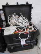 Two Tsunami hard plastic transport cases with contents of assorted cables. Located at Unit 1,