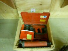 Hilti DX450 fastening tool with quantity of cartridges and wood case