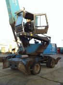 Fuchs MHL 350 material handler, S/No 3502101635, Date Of Manufacturer 2008. With 5 finger grab...