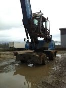 Fuchs MHL 350 material handler, S/No 3503104057, Date Of Manufacturer 2012. With 5 finger grab...