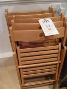 Five wooden folding chairs