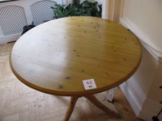 Light oak veneered round table