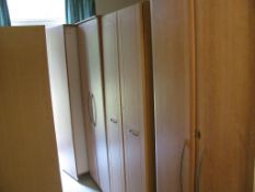 Nine various style light oak veneered wardrobes