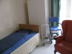 Contents of Room to include: Days electric Profile bed, 2 door wardrobe, Wingback chair, Plastic