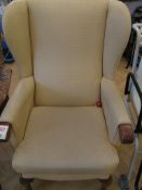 One oatmeal upholstered wingback arm chair