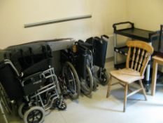 Contents of Room to include: Six folding wheel chairs, Rubbermaid hostess trolley, Wooden chair, Two