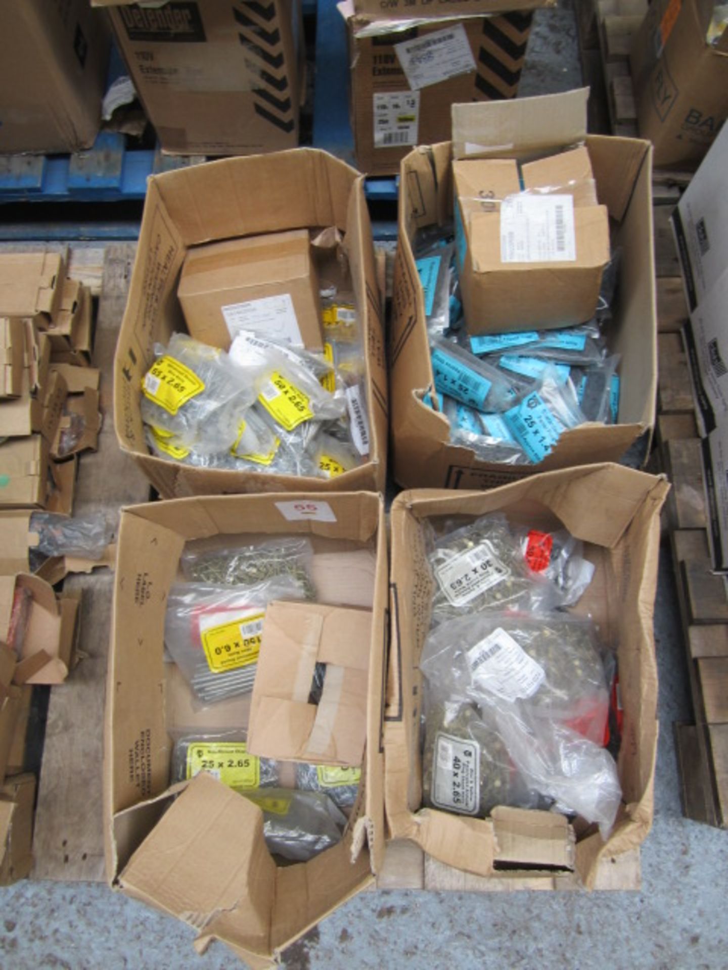 Four boxes of assorted consumables including 150 x 6.0 wire nails, panel pins, ring shark nails,