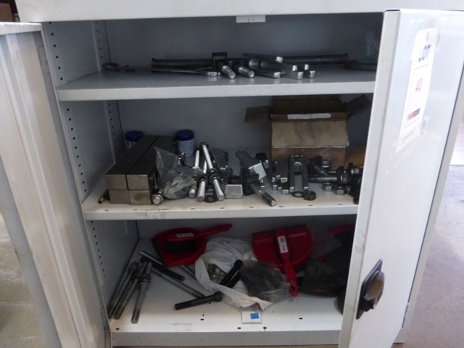 Metal cabinet complete with contents to include machine setting clamps etc