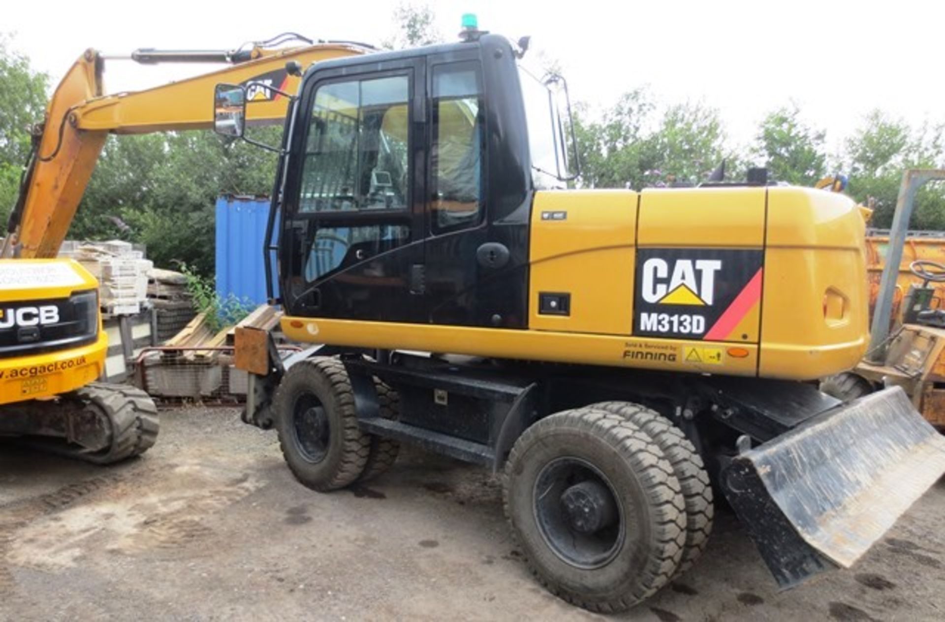 Caterpillar M313D wheeled hydraulic excavator with rear dozer and hydraulic supports, product ID No: