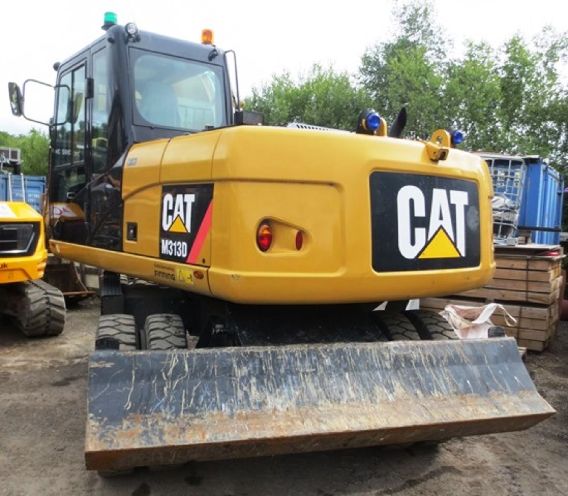 Caterpillar M313D wheeled hydraulic excavator with rear dozer and hydraulic supports, product ID No: - Image 2 of 21