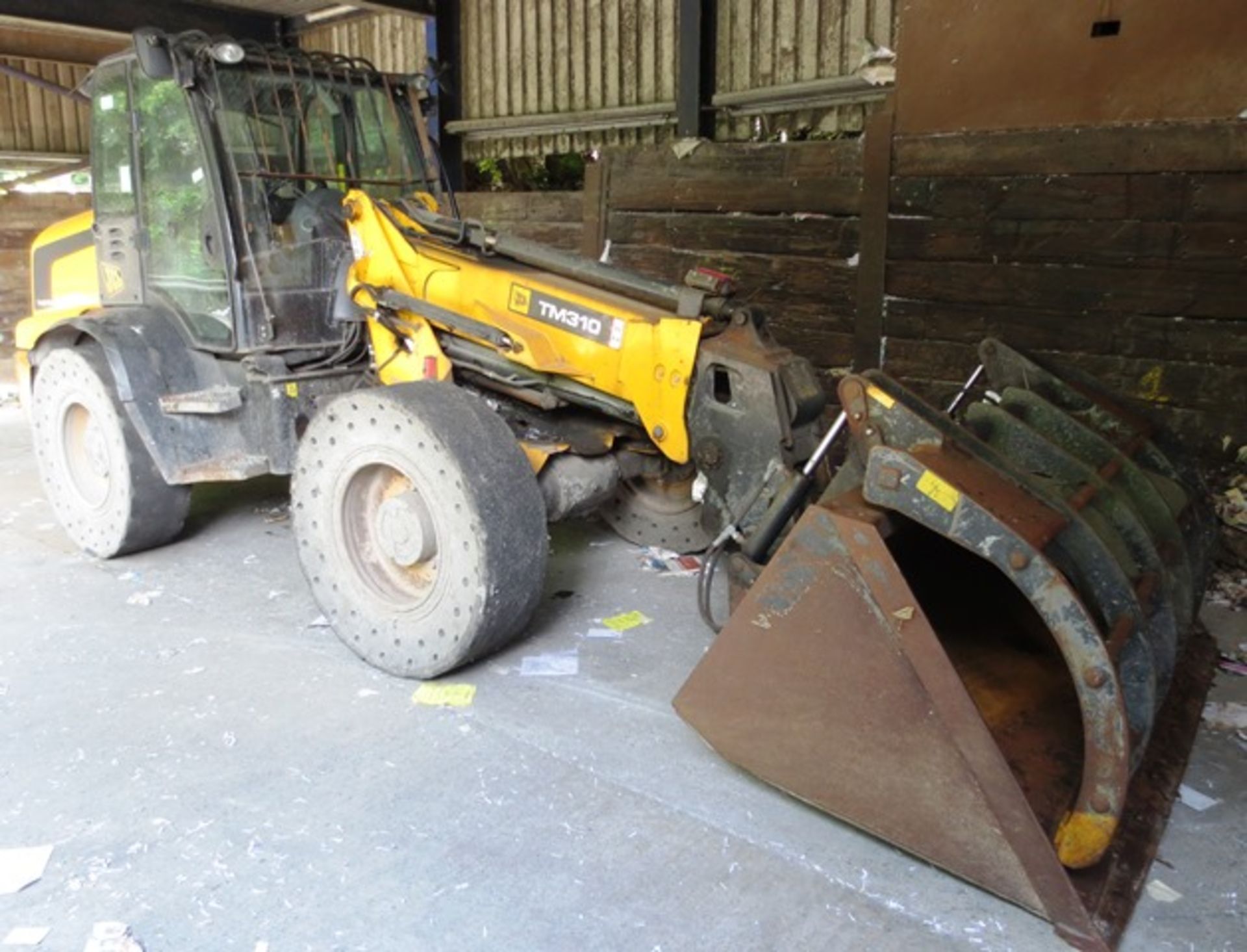 JCB TM 310 Wastemaster articulated 4 WD loading shovel, serial no. JCB310T0V01315679 (2010) recorded