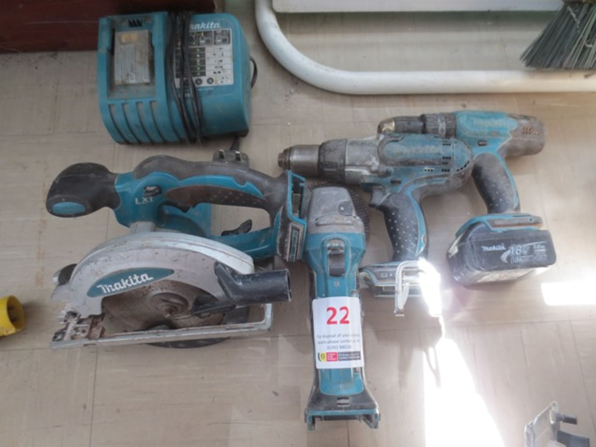 Two Makita 18v Li Ion powered drills, Makita M14 angle grinder, Makita BSS610 circular saw, one