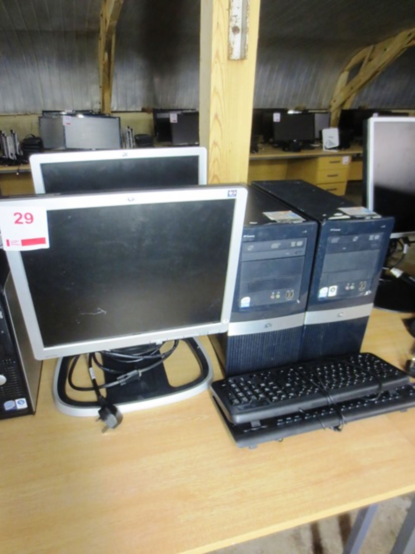 Two HP Compaq DX2400 micro towers, serial nos: 2UA9166FTB, 2AU84968DS, two flat screen monitors,