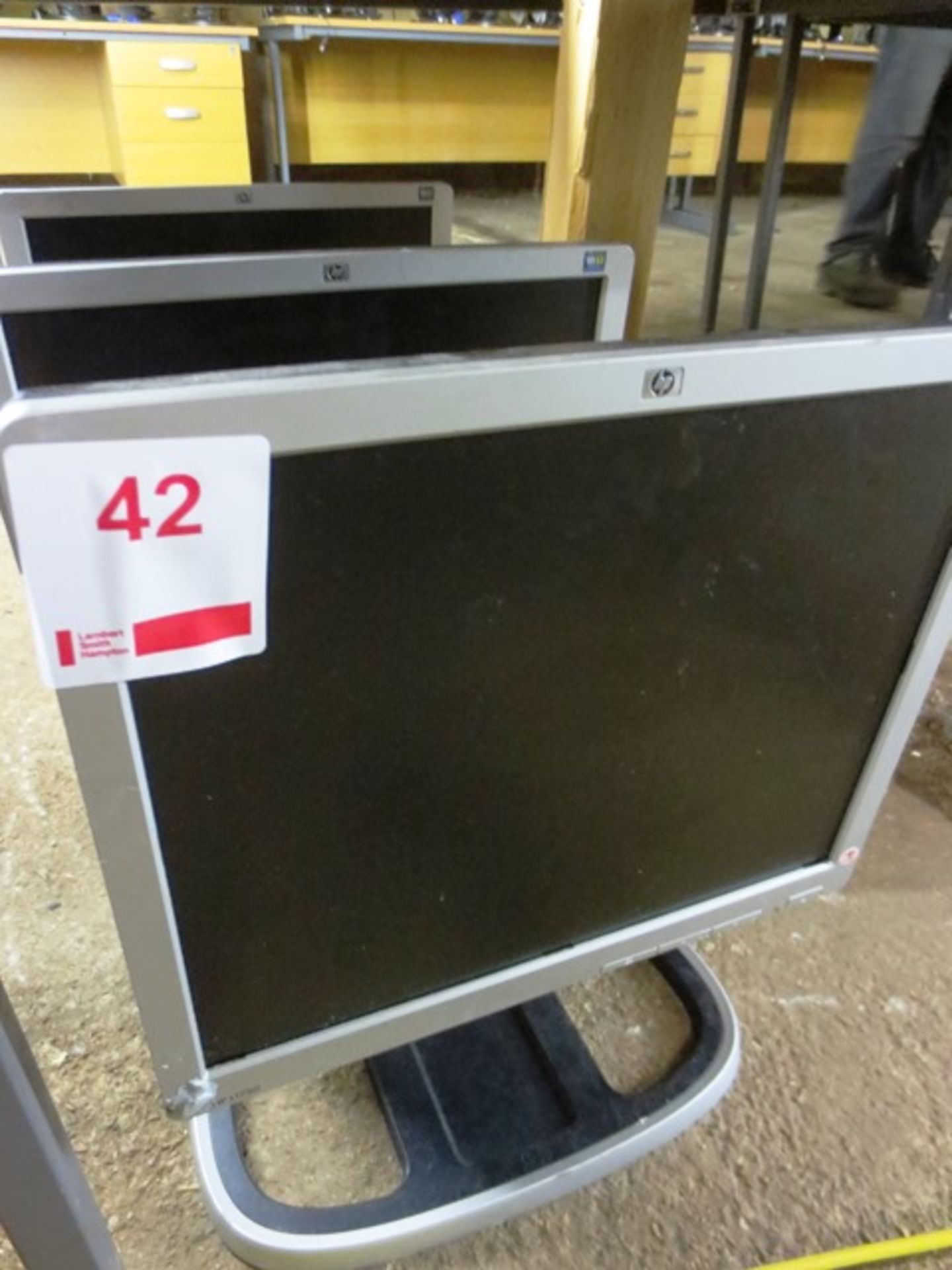 Three HP flat screen LCD monitors