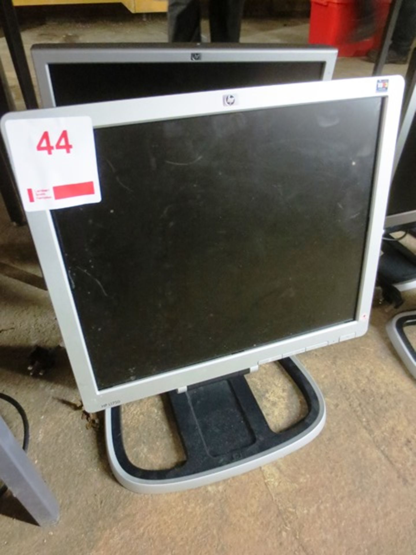 Two HP flat screen LCD monitors