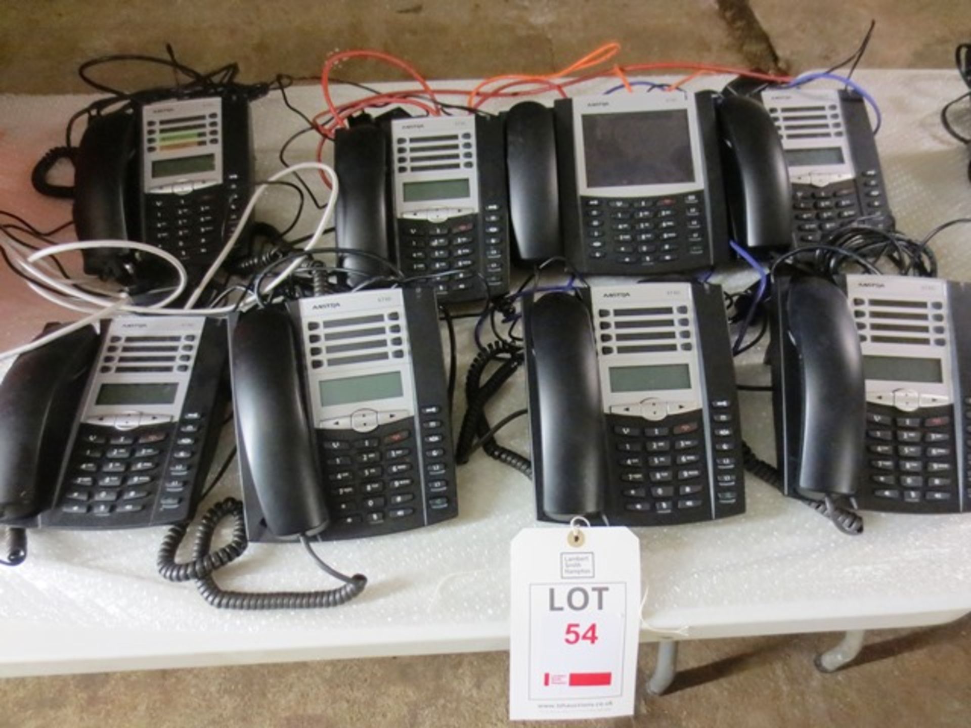 Seven Aastra 6730i telephone handsets, and one Aastra 6739i telephone handset