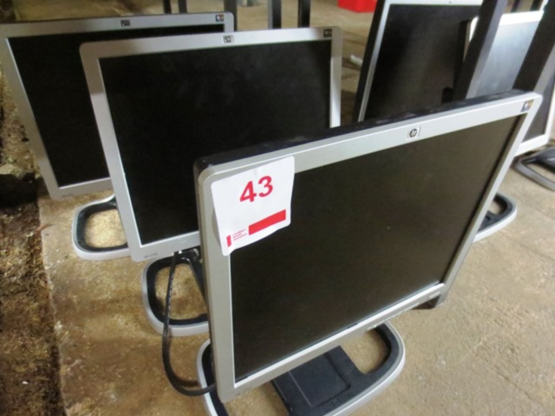 Three HP flat screen LCD monitors