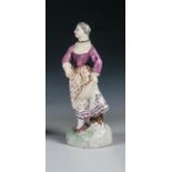 KartenspielerinLimbach, um  1780 Auf annähernd rundem Baumstützsockel stehende Dame. Sie trägt einen