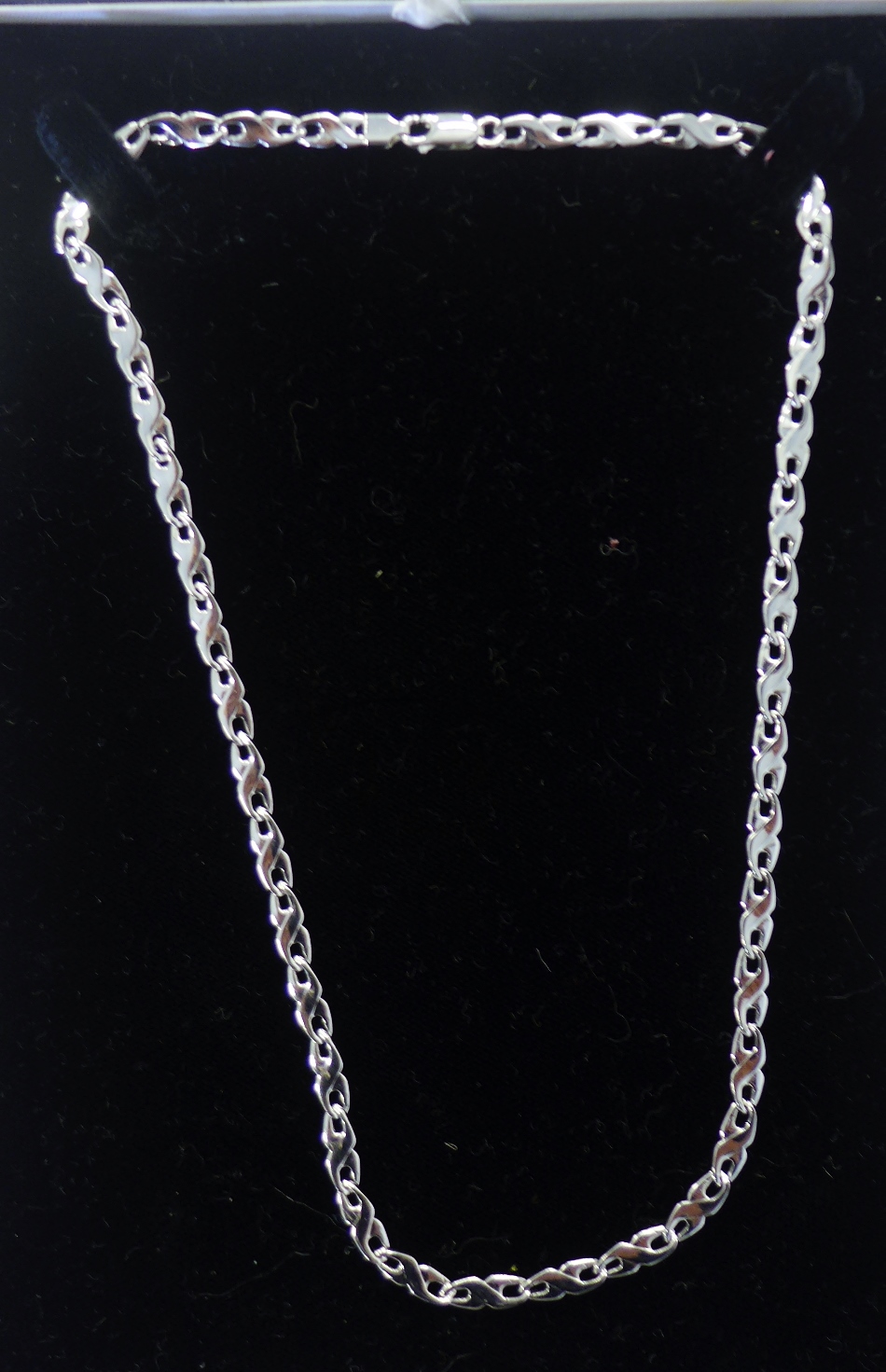 A modern white gold flat curb link chain necklace, stamped 375