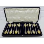 George V set of twelve silver teaspoons with matching sugar tongs, maker's mark for James Dixon &