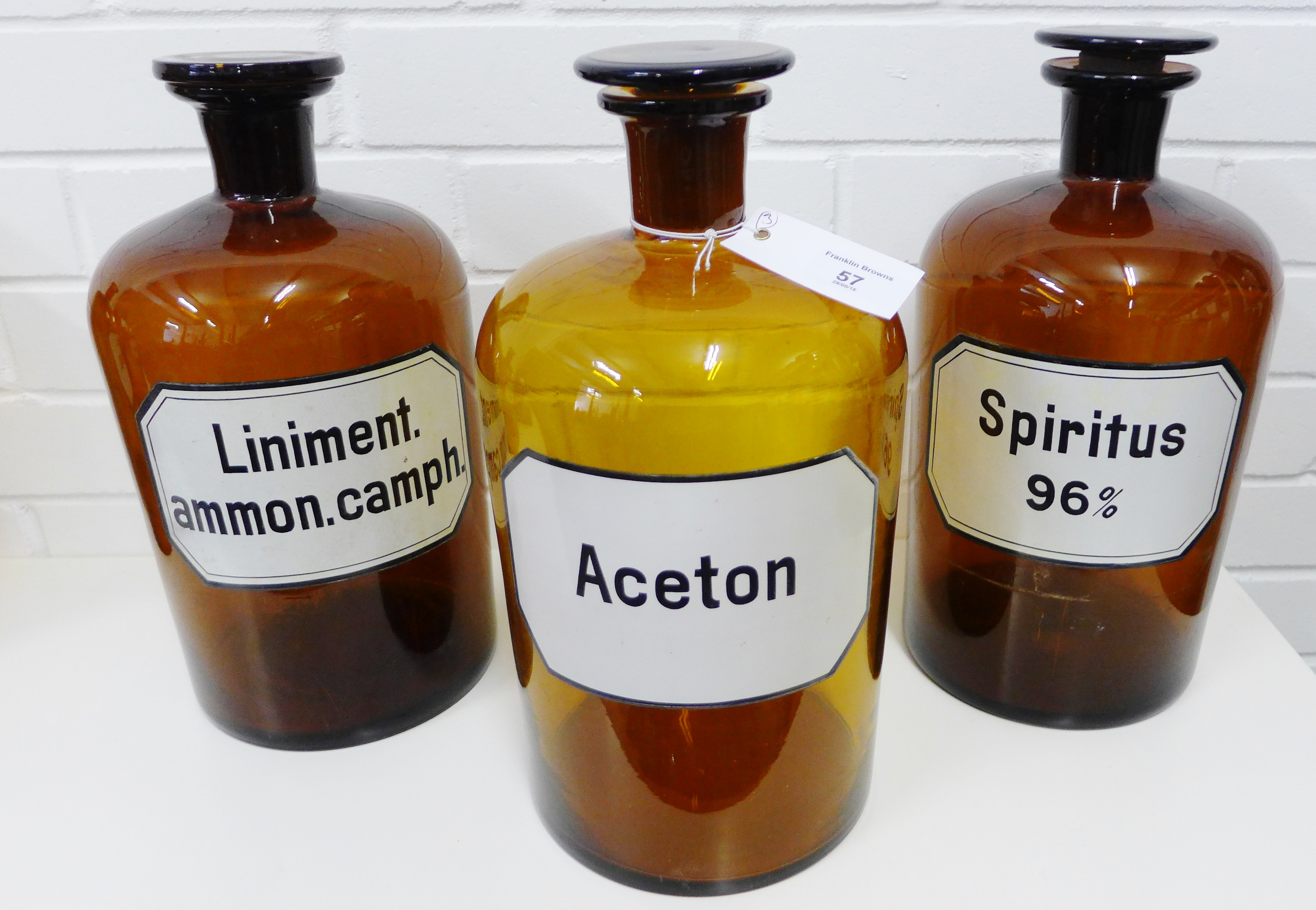 A set of three amber glass chemist bottles, labelled for Liniment ammon camph,  Aceton and