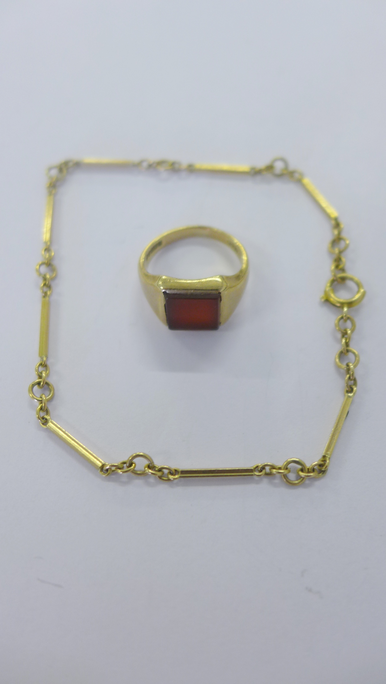 9ct gold hardstone set pinkie ring together with a 9ct gold fancy link bracelet (2)