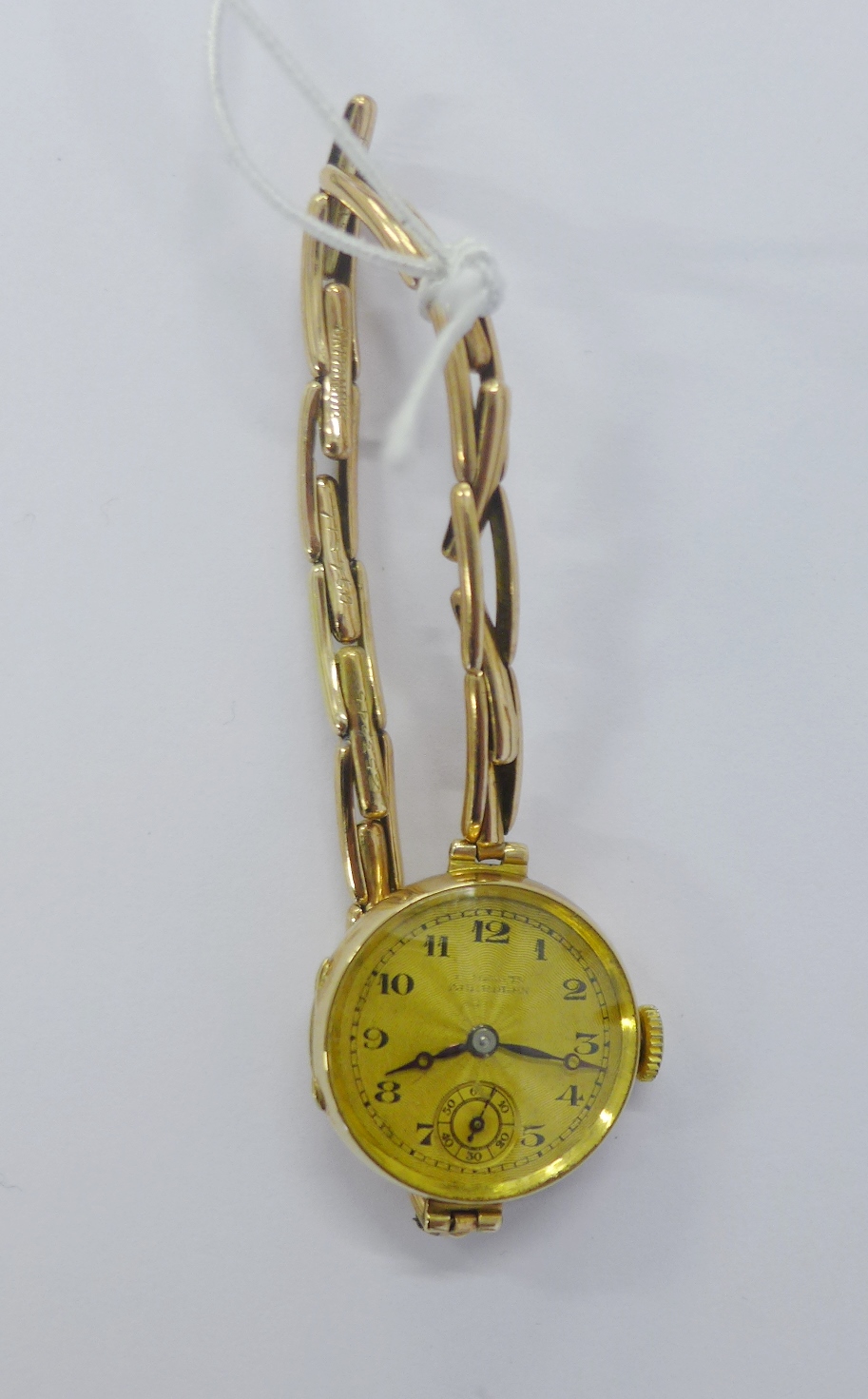 Lady's vintage 9ct gold cased wristwatch with Arabic numerals and subsidiary seconds dial on an
