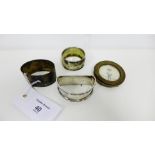 Three silver napkin rings and a small circular silver photograph frame, mixed hallmarks (4)