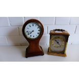 An Edwardian mahogany and inlaid dome top mantle clock, the circular enamel dial with Roman