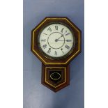 A vintage Thomaston Conn mahogany framed wall clock having a white face and Roman numeral dial, 37 x