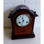 An Edwardian mahogany and inlaid dome top mantle clock,  the enamel dial flanked by columns,