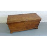 A 19th century elm kist with hinged cover the interior with a candle box, 116 x 55cm