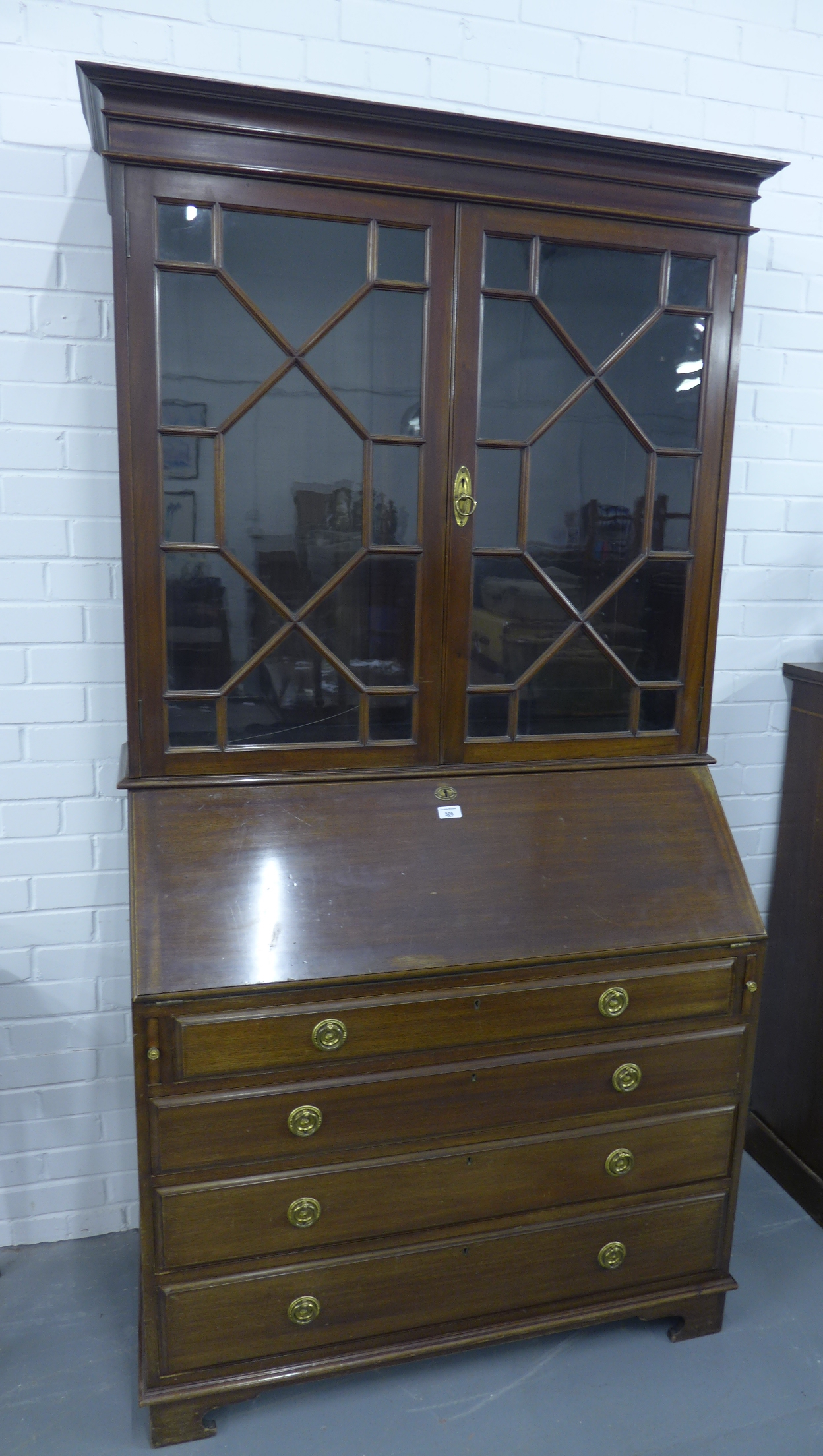 Georgian style mahogany bureau bookcase, the moulded cornice above a pair of astragal glazed