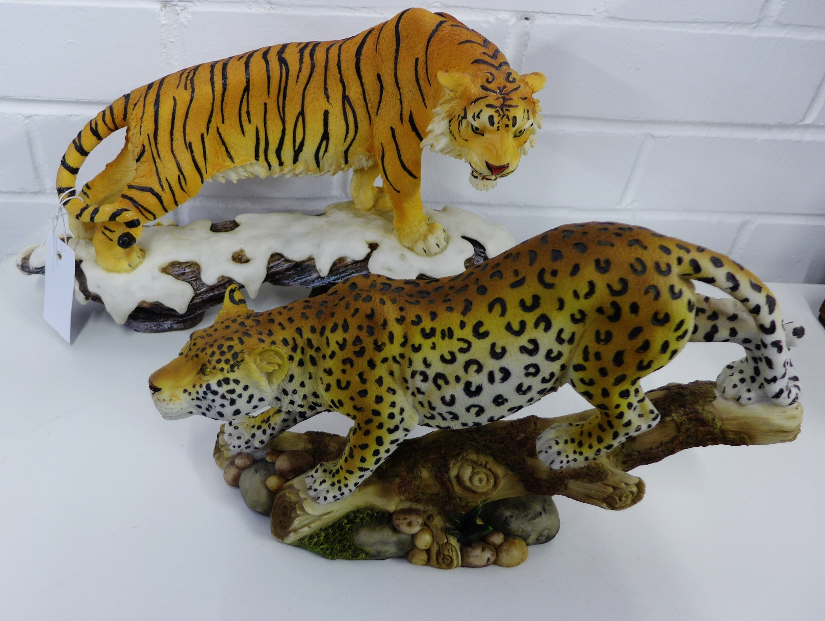 Two contemporary figures to include a tiger and leopard by Regency