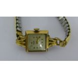 Vintage Benson of London 9 carat gold cased lady's wristwatch on gold plated expandable bracelet