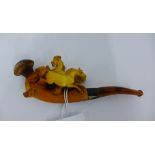 Meerschaum pipe with carved horse figures, white metal collar and amber cheroot complete with