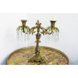 An ormolu two-light table lustre, with clear glass drops, 36cm high approx.