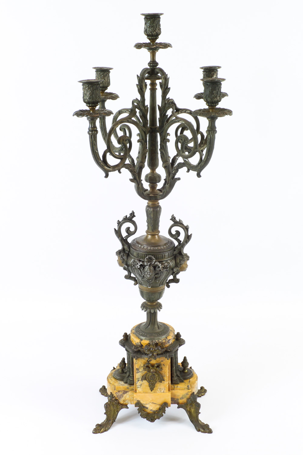 A neoclassical bronze five-light candelabra with vase form stem, on stepped marble footed base, 80cm