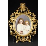 An unusual KPM Berlin porcelain plaque, oval, painted with two young girls in white dresses with