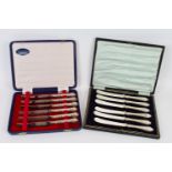 A cased set of six silver handled butter knives, in fitted case, Sheffield 1977; together with