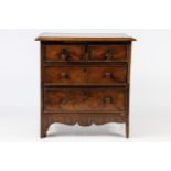A 19th century walnut apprentice chest of two short over two long drawers