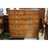 A mahogany chest of two short over four long drawers, original round brass handles, raised on