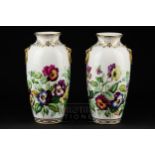 A pair of Minton ermine mark vases, of baluster form with integral ring handles, well painted with