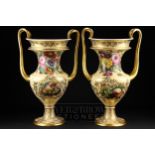 A large pair of Copeland & Garrett feldspar porcelain two-handled urns, painted with brightly