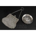 A small silver chainmail purse, makers mark WB, Birmingham 1909; and a small silver pin tray,