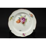 A late 18th century Meissen Marcolini period plate, decorated with deutsche Blumen, with ozier