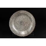 An Egyptian silver tray, profusely engraved with Islamic decoration, scalloped edge, Egyptian silver