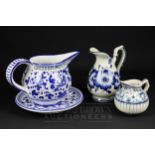 A blue & white plate; and three blue & white jugs (4)