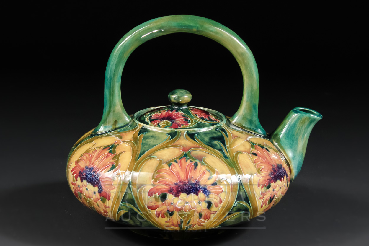 A William Moorcroft Cornflower pattern teapot or teakettle, tubelined with flowers and toned in