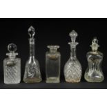 Three cut glass decanters & stoppers; another cut glass decanter, lacking stopper; a glass